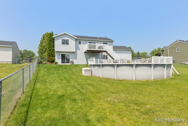 7088 Quintara Dr NE, Comstock Park, MI 49321 - back of property featuring a deck, stairs, and a fenced backyard