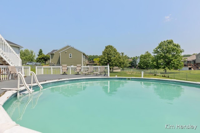 7088 Quintara Dr NE, Comstock Park, MI 49321 - outdoor pool featuring a deck