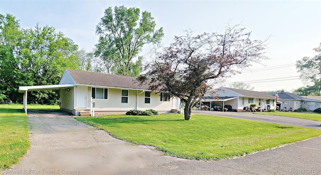 57035 Bonne Terre, New Hudson, MI 48165 - ranch-style house with asphalt driveway, a carport, and a front lawn