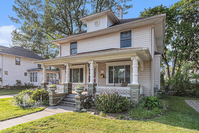 92 Gallup St, Mount Clemens, MI 48043 - american foursquare style home featuring a porch, a front lawn, and a chimney