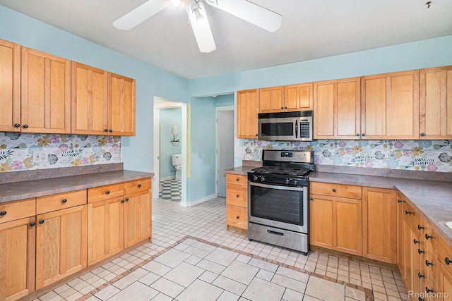92 Gallup St, Mount Clemens, MI 48043 - kitchen featuring stainless steel appliances, a ceiling fan, tasteful backsplash, and light tile patterned floors