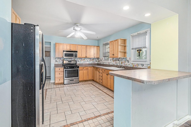 92 Gallup St, Mount Clemens, MI 48043 - kitchen with stainless steel appliances, light brown cabinetry, a peninsula, backsplash, and open shelves