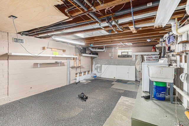 92 Gallup St, Mount Clemens, MI 48043 - below grade area featuring washing machine and dryer and concrete block wall