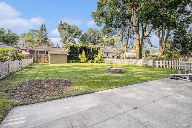 92 Gallup St, Mount Clemens, MI 48043 - fenced backyard with a fire pit and a patio
