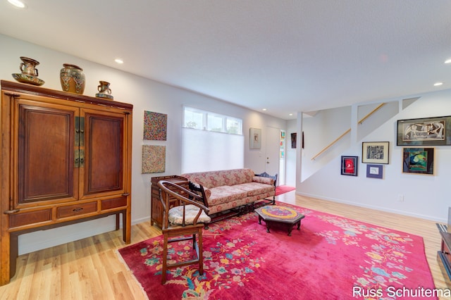 1366 W Norton Ave, Muskegon, MI 49441 - living room with light wood finished floors, stairs, and recessed lighting
