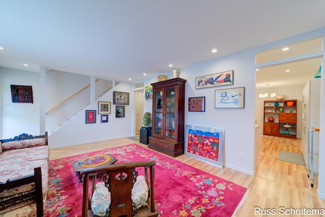 1366 W Norton Ave, Muskegon, MI 49441 - living room with light wood-type flooring, stairs, and recessed lighting