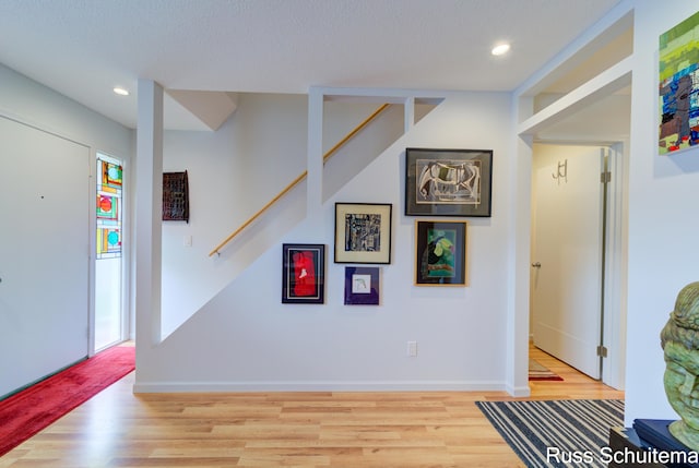 1366 W Norton Ave, Muskegon, MI 49441 - hall featuring wood finished floors, stairs, and recessed lighting