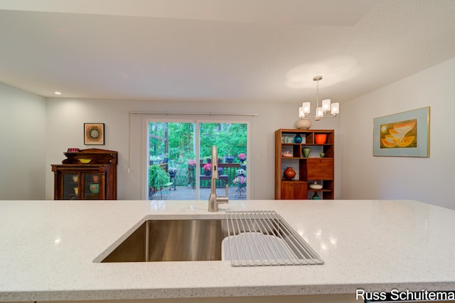 1366 W Norton Ave, Muskegon, MI 49441 - kitchen featuring a chandelier, light stone countertops, hanging light fixtures, and recessed lighting