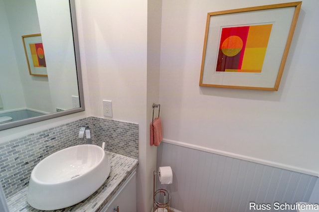 1366 W Norton Ave, Muskegon, MI 49441 - half bathroom with a wainscoted wall and vanity