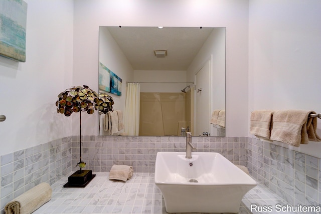 1366 W Norton Ave, Muskegon, MI 49441 - bathroom with a shower with curtain and tile walls