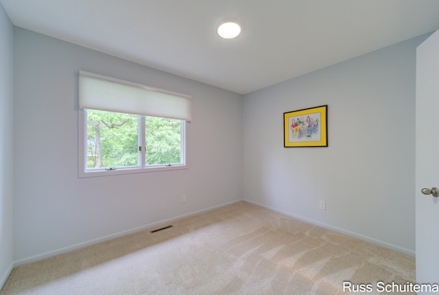 1366 W Norton Ave, Muskegon, MI 49441 - carpeted empty room featuring baseboards