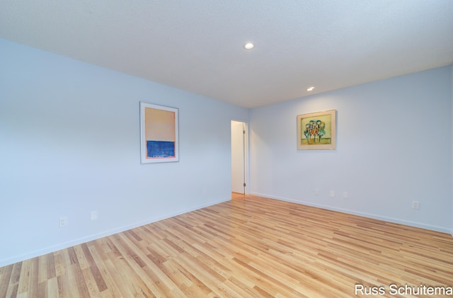 1366 W Norton Ave, Muskegon, MI 49441 - empty room with light wood-style flooring and recessed lighting