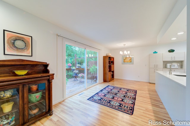 1366 W Norton Ave, Muskegon, MI 49441 - dining space with a chandelier, light wood finished floors, and recessed lighting