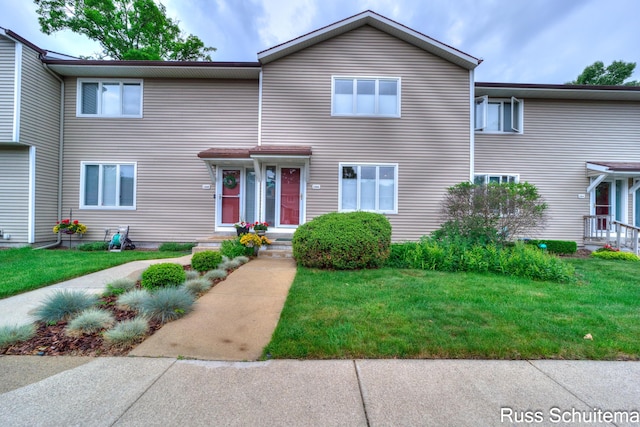 1366 W Norton Ave, Muskegon, MI 49441 - view of front facade featuring a front yard