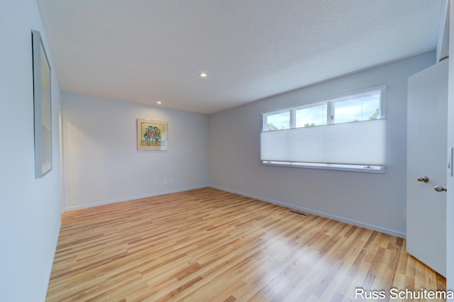1366 W Norton Ave, Muskegon, MI 49441 - spare room featuring wood finished floors and recessed lighting