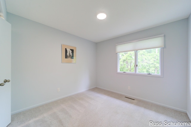 1366 W Norton Ave, Muskegon, MI 49441 - empty room featuring carpet floors and baseboards