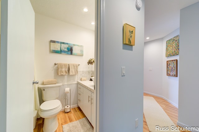 1366 W Norton Ave, Muskegon, MI 49441 - bathroom featuring wood finished floors, vanity, and recessed lighting