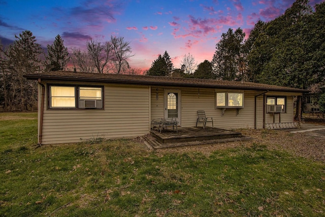 8887 Elm Valley Rd, Union Pier, MI 49129 - view of front facade with a wooden deck, a yard, and cooling unit