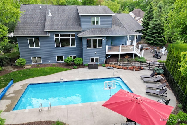 14921 Creek Edge Dr, Holland, MI 49424 - view of pool featuring a patio area, a fire pit, a fenced backyard, and a deck
