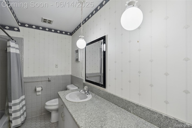 5614 Warbler Dr, Clarkston, MI 48346 - bathroom featuring wallpapered walls, a wainscoted wall, tile patterned flooring, vanity, and curtained shower