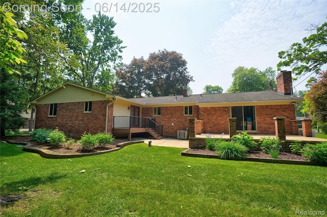 5614 Warbler Dr, Clarkston, MI 48346 - rear view of property featuring brick siding, a chimney, a lawn, and a patio