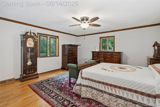 5614 Warbler Dr, Clarkston, MI 48346 - bedroom with light wood-style flooring, ceiling fan, and ornamental molding