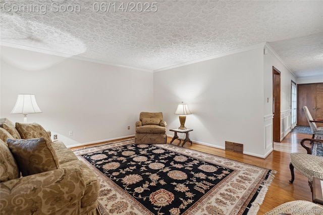 5614 Warbler Dr, Clarkston, MI 48346 - living area featuring wood finished floors, crown molding, and a textured ceiling