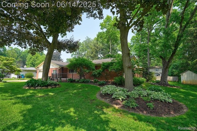 5614 Warbler Dr, Clarkston, MI 48346 - view of green lawn featuring a garage