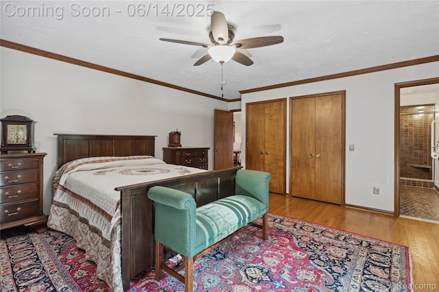 5614 Warbler Dr, Clarkston, MI 48346 - bedroom with wood finished floors, two closets, ensuite bath, and a ceiling fan