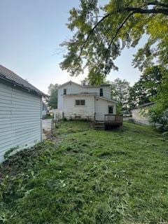 313 Morse St, Ionia, MI 48846 - back of property featuring a yard