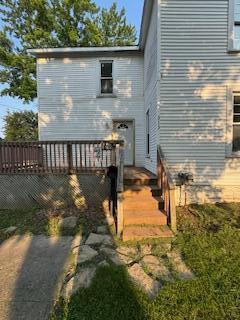 313 Morse St, Ionia, MI 48846 - rear view of property with a deck