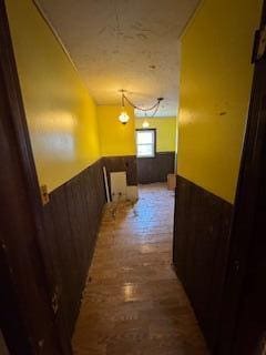 313 Morse St, Ionia, MI 48846 - hallway featuring a wainscoted wall
