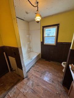 313 Morse St, Ionia, MI 48846 - bathroom with a wainscoted wall, vanity, a shower, and a tub to relax in