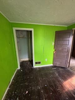 313 Morse St, Ionia, MI 48846 - empty room with baseboards and wood finished floors
