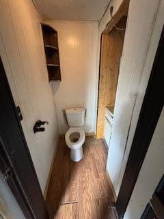 313 Morse St, Ionia, MI 48846 - bathroom with wood finished floors and wooden walls