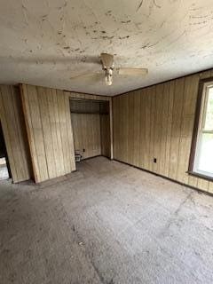 313 Morse St, Ionia, MI 48846 - unfurnished bedroom featuring wooden walls
