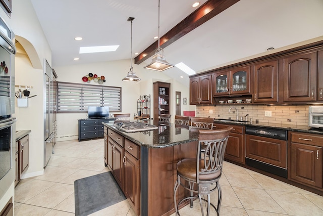 3524 Lakeshore Rd, Manistee, MI 49660 - kitchen featuring a skylight, light tile patterned floors, a kitchen island, backsplash, and recessed lighting