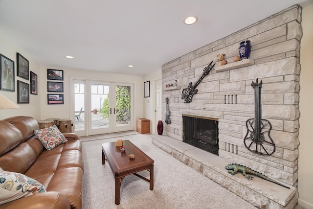 3524 Lakeshore Rd, Manistee, MI 49660 - living room featuring carpet, a stone fireplace, and recessed lighting