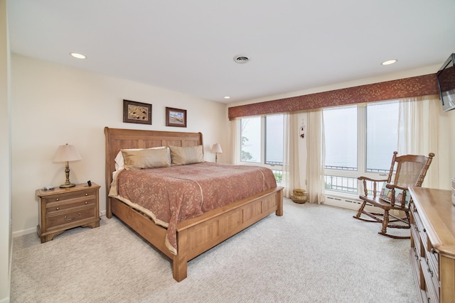 3524 Lakeshore Rd, Manistee, MI 49660 - bedroom with light colored carpet, recessed lighting, and access to exterior