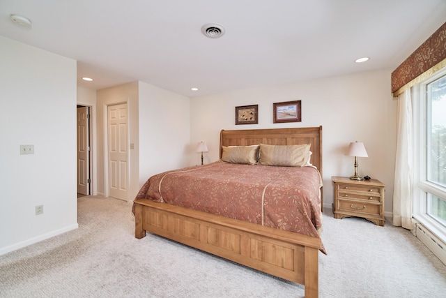 3524 Lakeshore Rd, Manistee, MI 49660 - bedroom featuring carpet, multiple windows, recessed lighting, and a baseboard heating unit