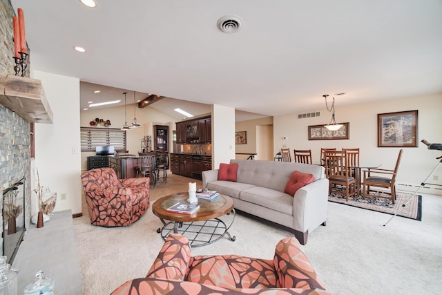 3524 Lakeshore Rd, Manistee, MI 49660 - living area featuring light colored carpet, a fireplace, lofted ceiling, and recessed lighting