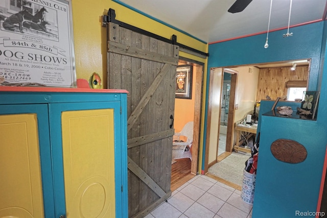 33566 Rhonswood St, Farmington Hills, MI 48335 - corridor with a barn door and tile patterned flooring