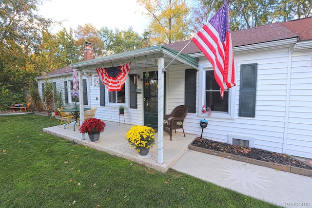 33566 Rhonswood St, Farmington Hills, MI 48335 - view of front of property with a front lawn, a chimney, and roof with shingles