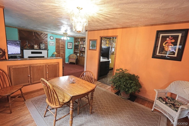 33566 Rhonswood St, Farmington Hills, MI 48335 - dining space featuring light wood finished floors, a chandelier, and ceiling fan