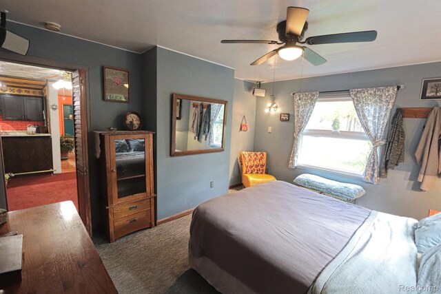 33566 Rhonswood St, Farmington Hills, MI 48335 - bedroom with dark colored carpet and ceiling fan