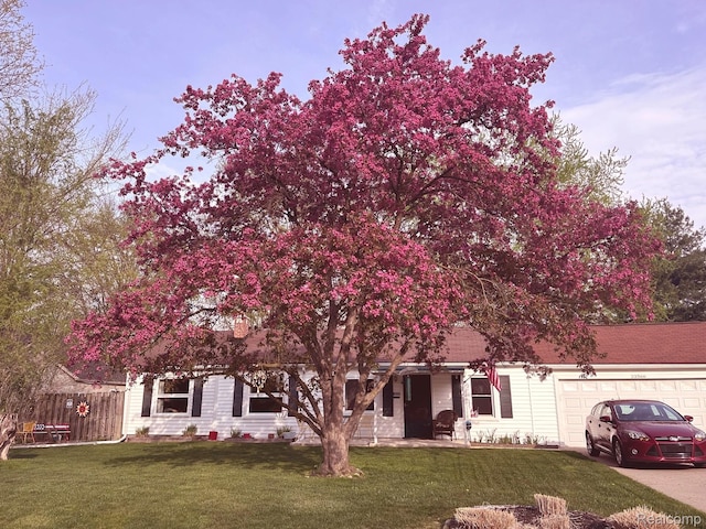 33566 Rhonswood St, Farmington Hills, MI 48335 - view of property hidden behind natural elements with a garage and driveway