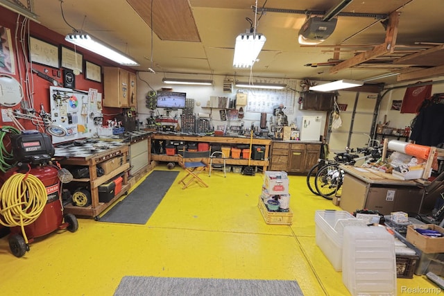 33566 Rhonswood St, Farmington Hills, MI 48335 - miscellaneous room with a workshop area and finished concrete flooring