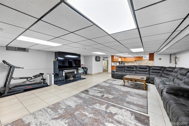 7561 Esper Blvd, Dearborn, MI 48126 - living area featuring tile patterned flooring, a drop ceiling, and a fireplace