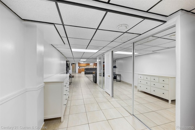 7561 Esper Blvd, Dearborn, MI 48126 - finished basement with a paneled ceiling and light tile patterned flooring