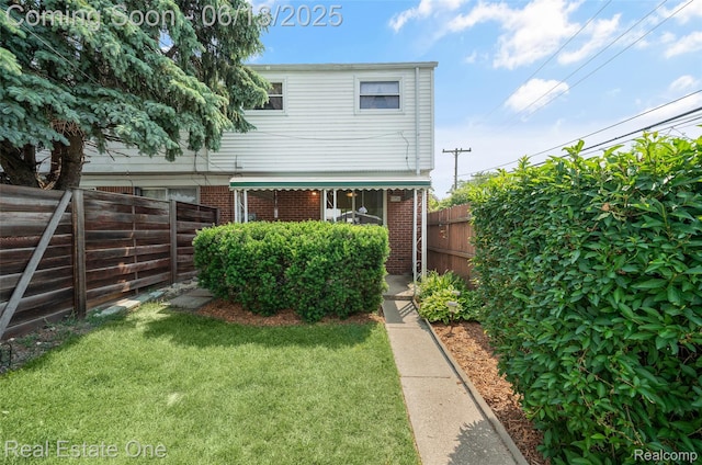 20107 Merle Ct, Eastpointe, MI 48035 - back of house with brick siding and a fenced backyard
